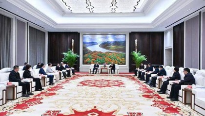 许勤会见吉利控股集团董事长李书福